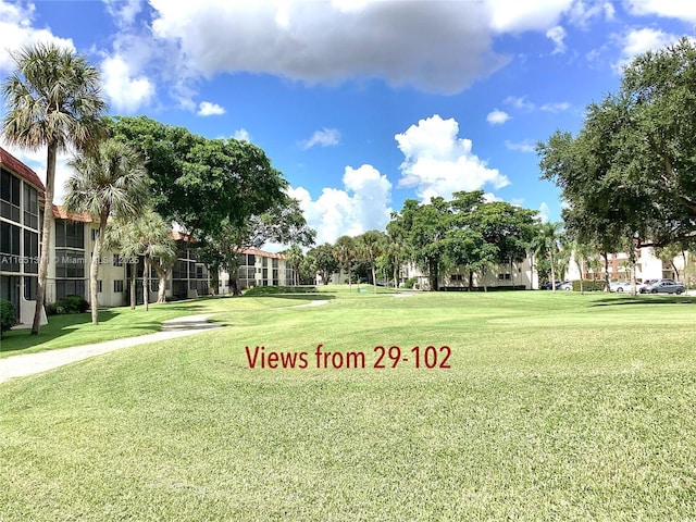 611 S Hollybrook Dr Unit 102, Pembroke Pines, FL 33025 - surrounding community with a lawn and golf course view