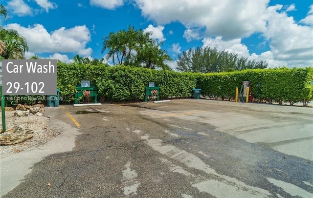 611 S Hollybrook Dr Unit 102, Pembroke Pines, FL 33025 - view of community with uncovered parking