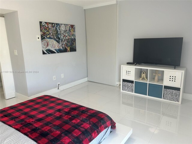 bedroom featuring light tile patterned flooring