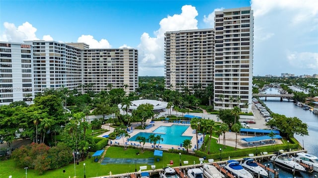 view of building exterior with a city view and a water view