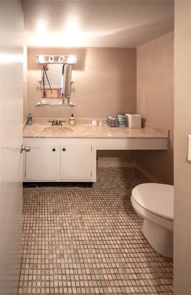 half bath with toilet and vanity