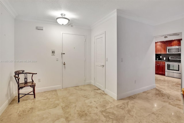 9801 Collins Ave Unit 3T, Bal Harbour, FL 33154 - foyer with baseboards, ornamental molding, and a textured ceiling