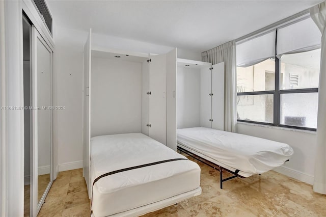 9801 Collins Ave Unit 3T, Bal Harbour, FL 33154 - bedroom featuring visible vents and baseboards