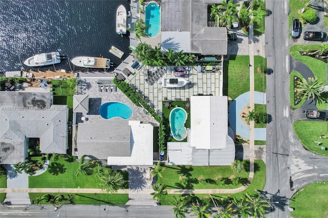 birds eye view of property with a water view