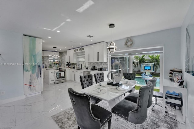 dining area featuring sink