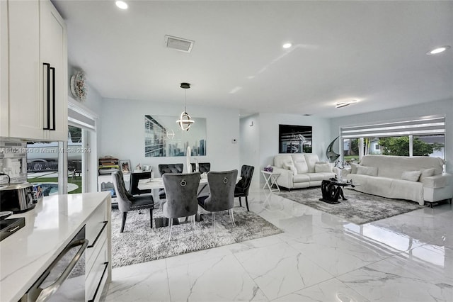 dining area with a notable chandelier