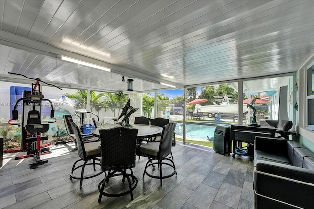 sunroom / solarium with wooden ceiling