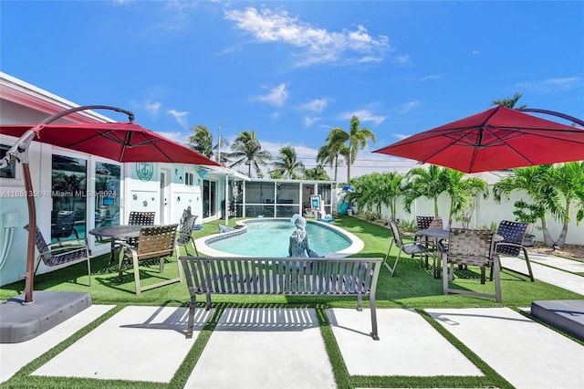 view of patio featuring a sunroom