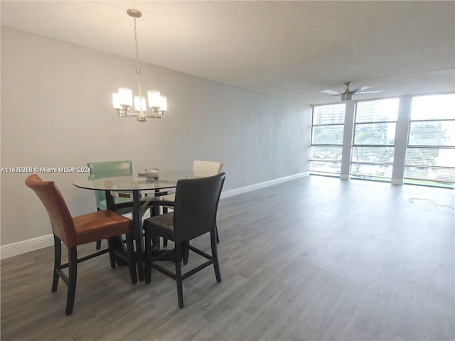 dining space with ceiling fan with notable chandelier, a textured ceiling, and dark hardwood / wood-style floors