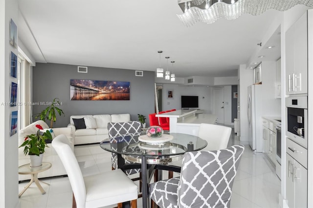 dining space with an inviting chandelier