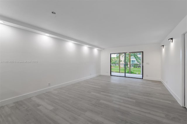 empty room with light hardwood / wood-style floors