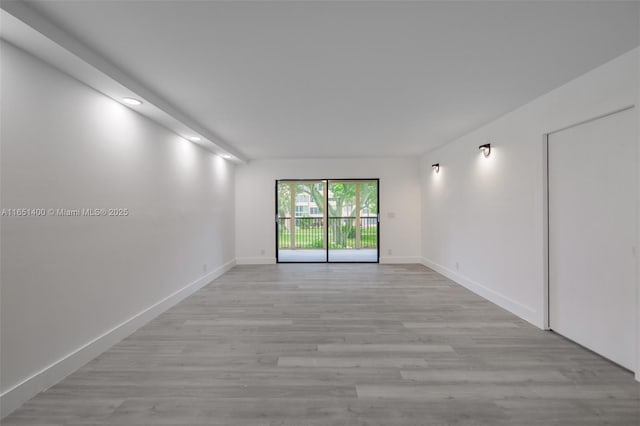 unfurnished room featuring light hardwood / wood-style floors