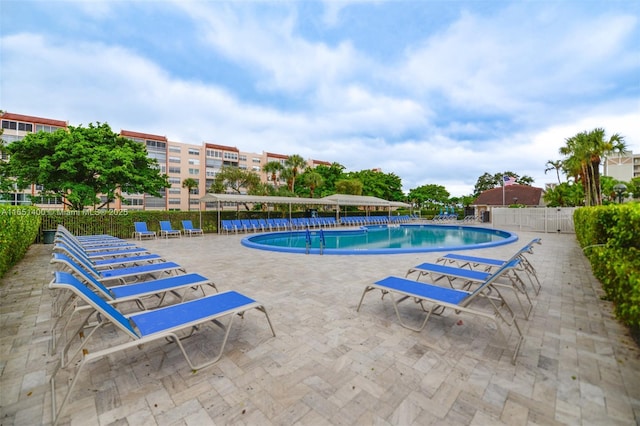 view of swimming pool with a patio area