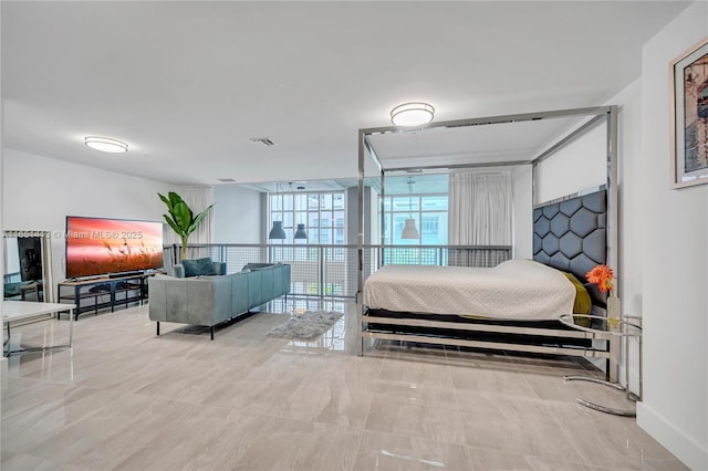 bedroom featuring expansive windows