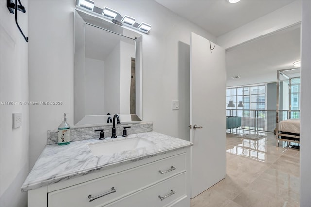 bathroom with vanity and expansive windows