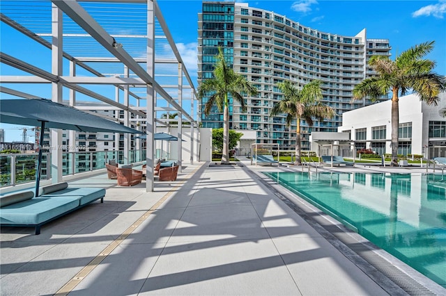 view of pool featuring a patio and a pergola