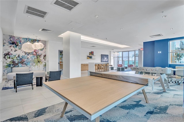 rec room with light tile patterned flooring and a healthy amount of sunlight