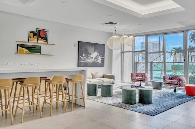 interior space with floor to ceiling windows and light tile patterned flooring