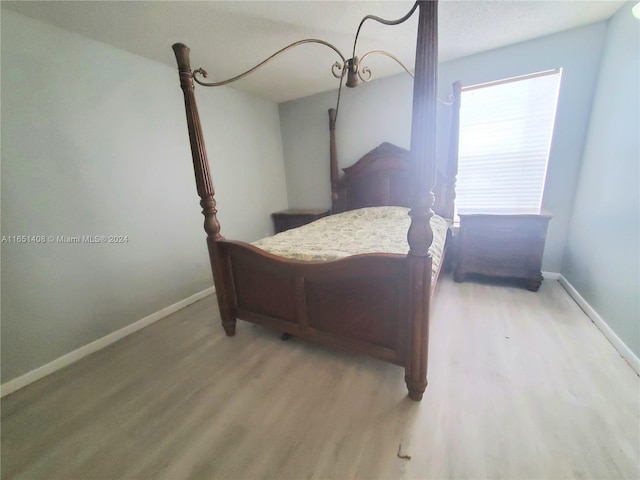 bedroom with hardwood / wood-style flooring