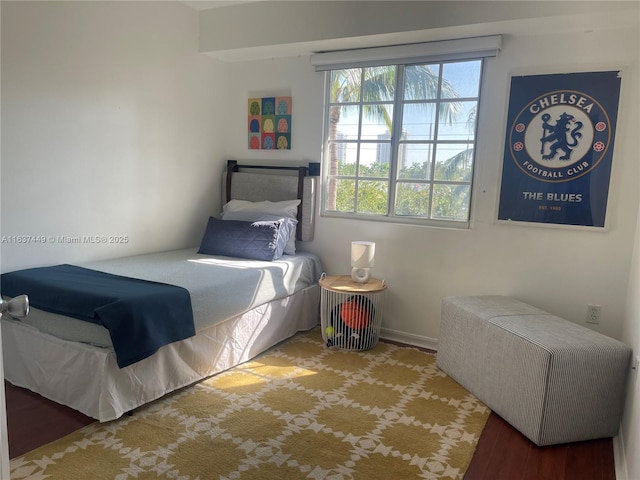 bedroom with wood-type flooring