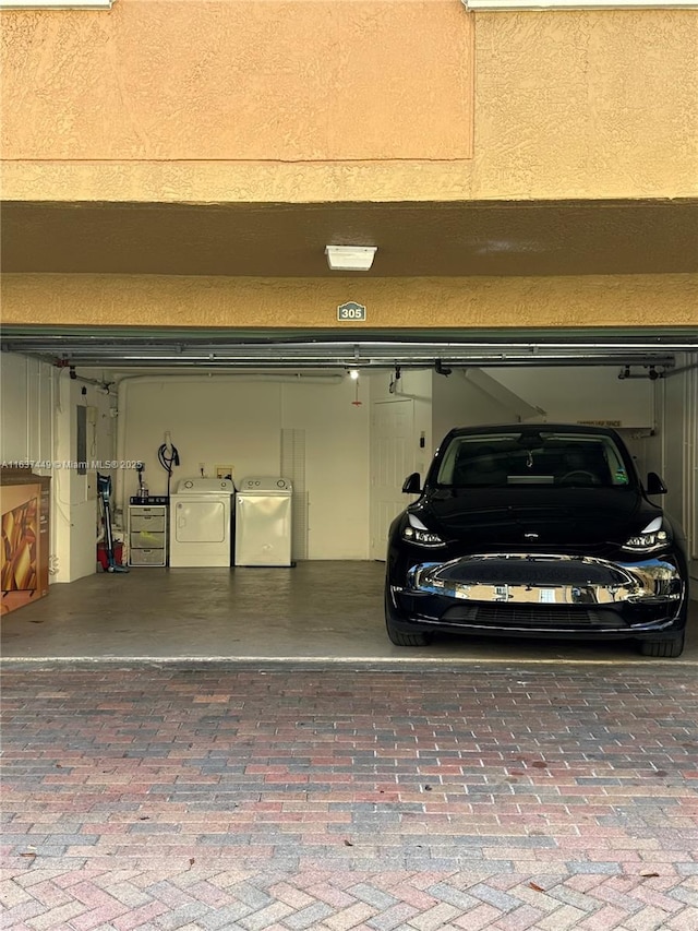 garage with independent washer and dryer