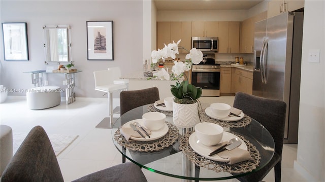 dining space with light tile patterned floors