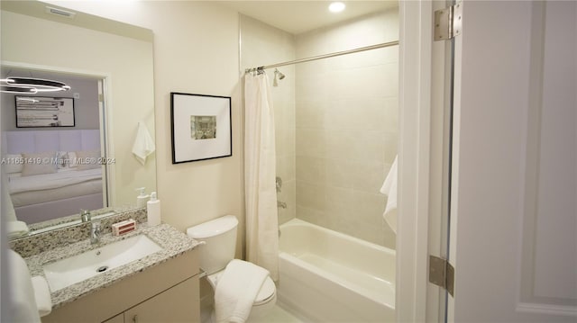 full bathroom featuring vanity, toilet, and shower / tub combo with curtain