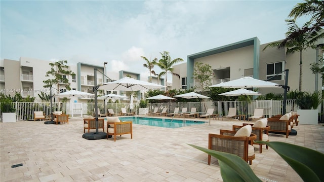 view of swimming pool with a patio area