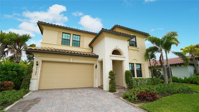 mediterranean / spanish-style home featuring a garage