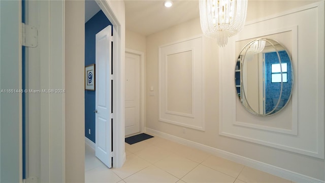 interior space featuring light tile patterned floors and a notable chandelier