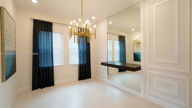 interior space featuring a notable chandelier and light tile patterned floors