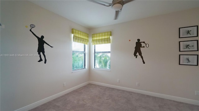 empty room with ceiling fan and light carpet