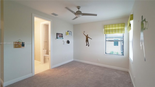 carpeted empty room with ceiling fan