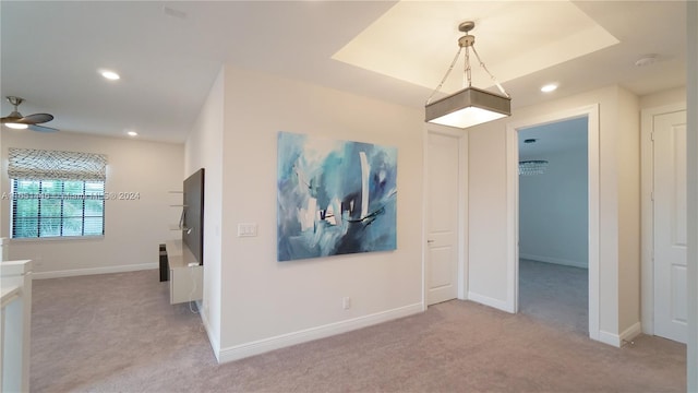 interior space with light colored carpet and ceiling fan