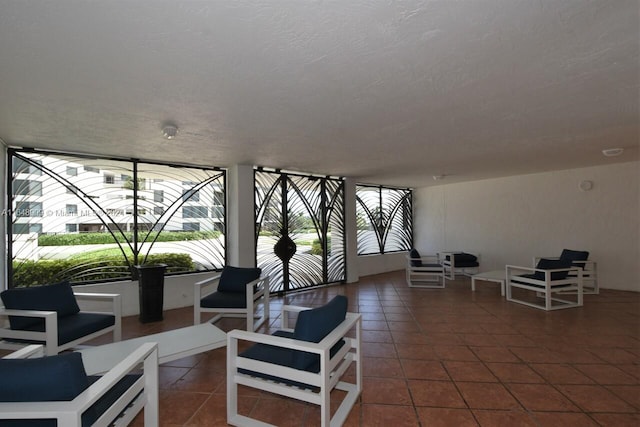 interior space with tile patterned flooring and a textured ceiling