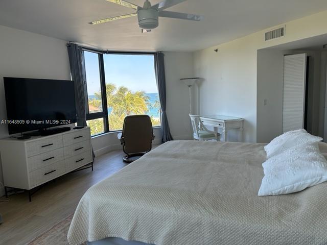 bedroom featuring ceiling fan and hardwood / wood-style flooring