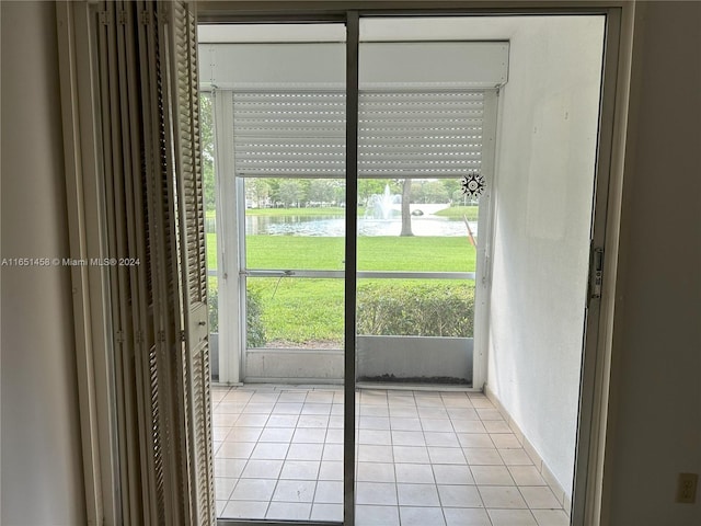 interior space with plenty of natural light and a water view