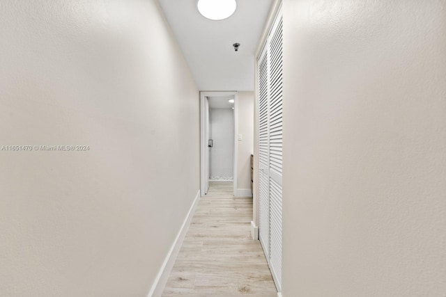 hall with light wood-type flooring