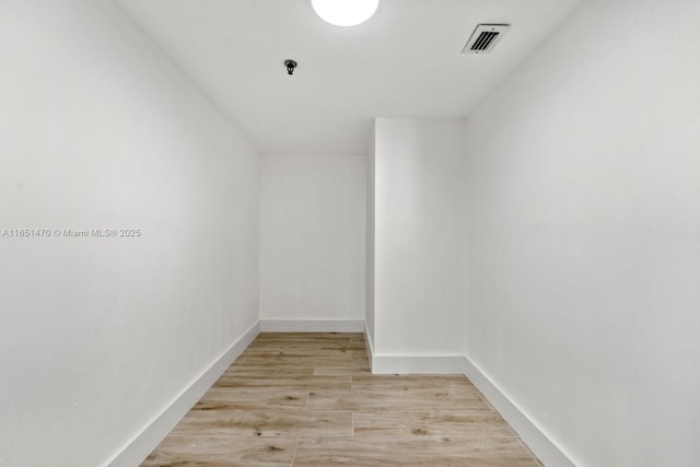 2625 Collins Ave Unit 309, Miami Beach, FL 33140 - empty room with visible vents, baseboards, and light wood-style flooring