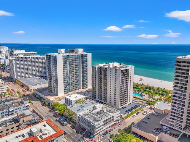 bird's eye view featuring a beach view and a water view