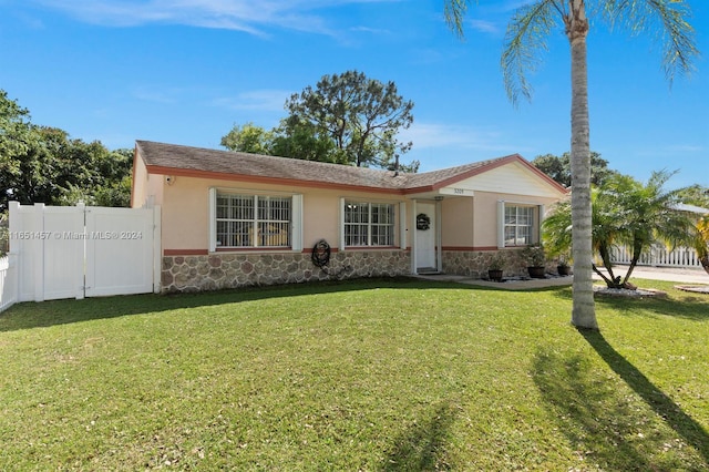 ranch-style house with a front yard