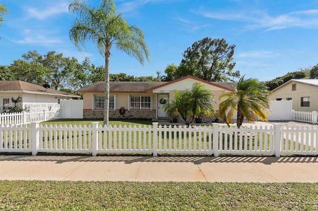 ranch-style home with a front yard