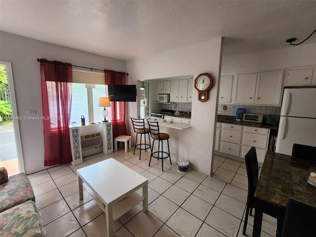 living room with light tile patterned floors