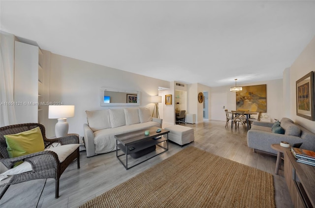 living room with light hardwood / wood-style flooring