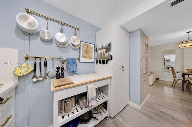 kitchen featuring light hardwood / wood-style flooring and appliances with stainless steel finishes