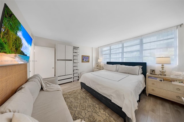 bedroom with light wood-type flooring