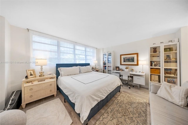 bedroom with light hardwood / wood-style flooring