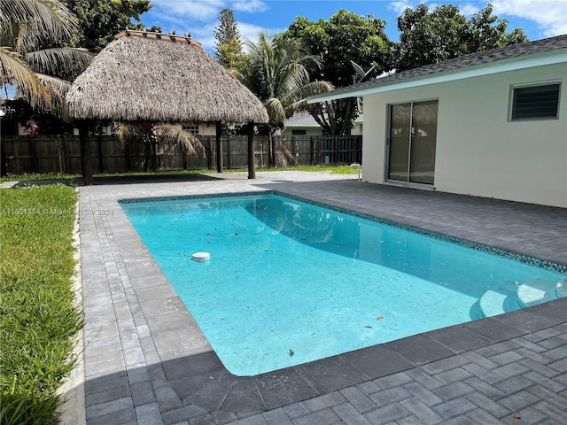 view of pool with a patio, a gazebo, a fenced backyard, and a fenced in pool