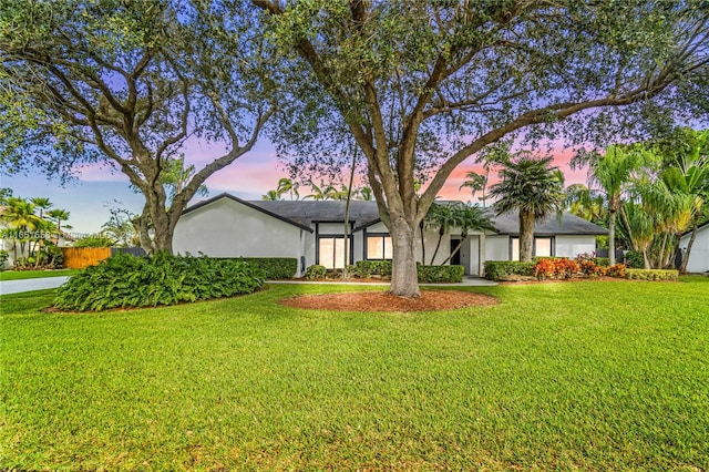 view of front of home with a lawn