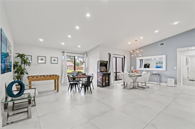 dining space featuring lofted ceiling and a chandelier